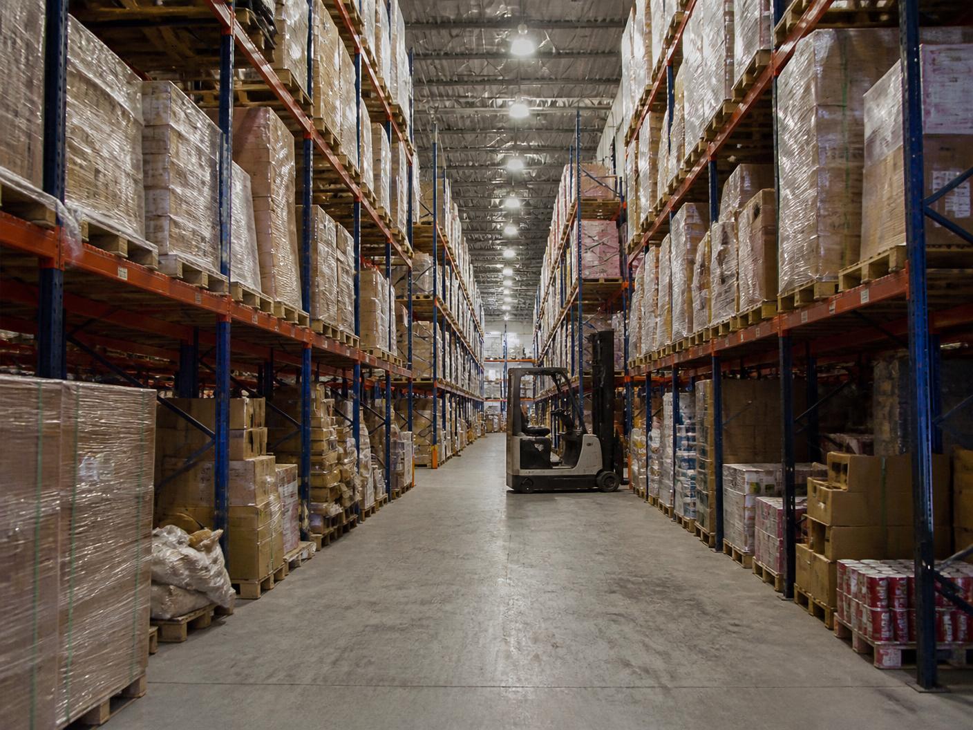 Inside the PalletCove Liquidation warehouse in Dallas, Texas with pallets staged for resellers